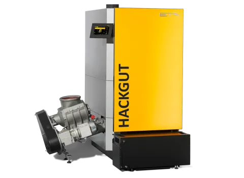 Ein gelber Hackgutkessel von ETA vor neutralen Hintergrund.