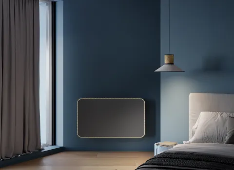 Horizontaler Designheizkörper Relax Hybrid mit LED-Beleuchtung im Schlafzimmer.